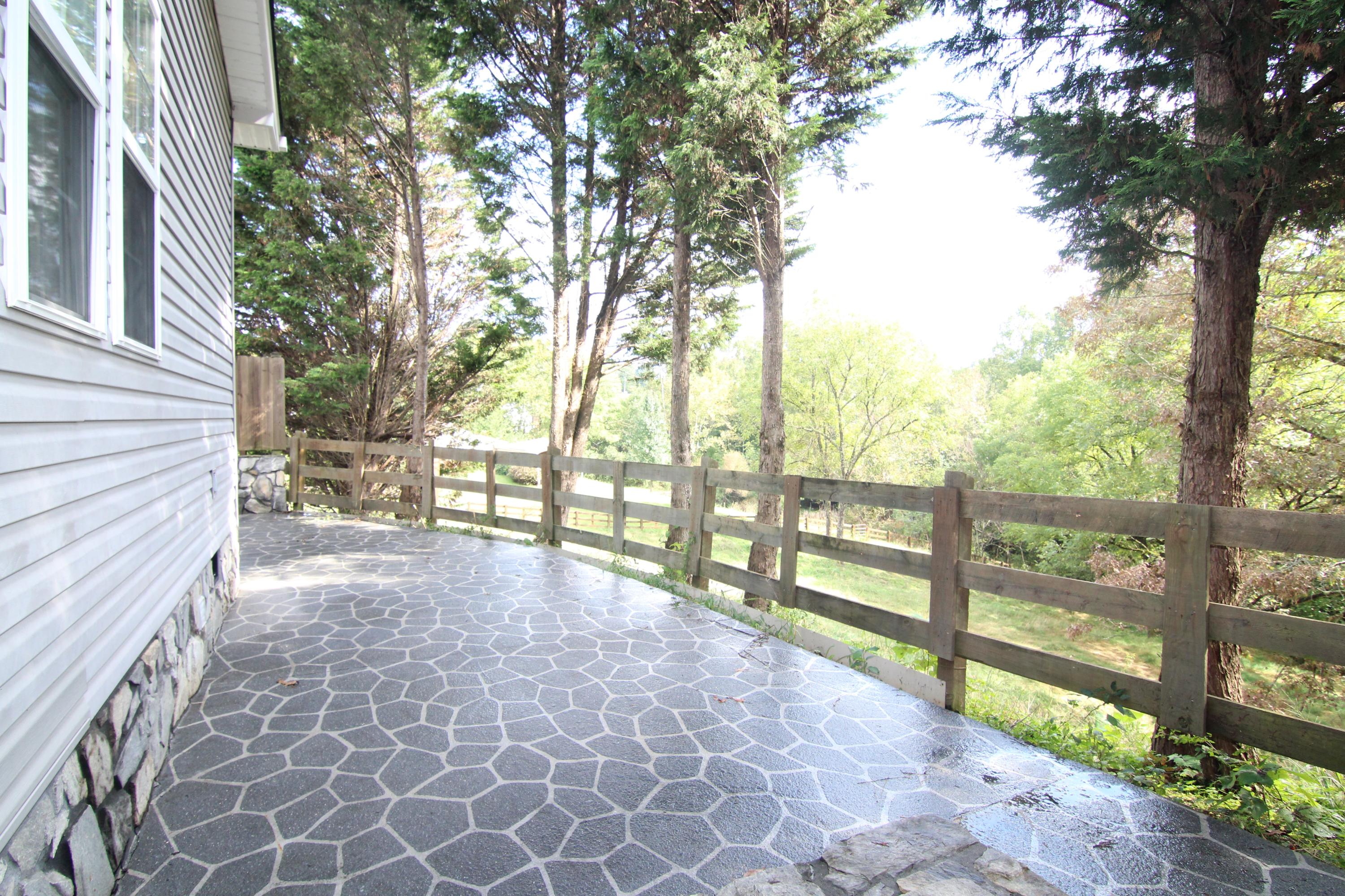 6773 Goodview Road Goodview, VA 24095 - Photo 24 of 43 a view of outdoor space with deck and trees