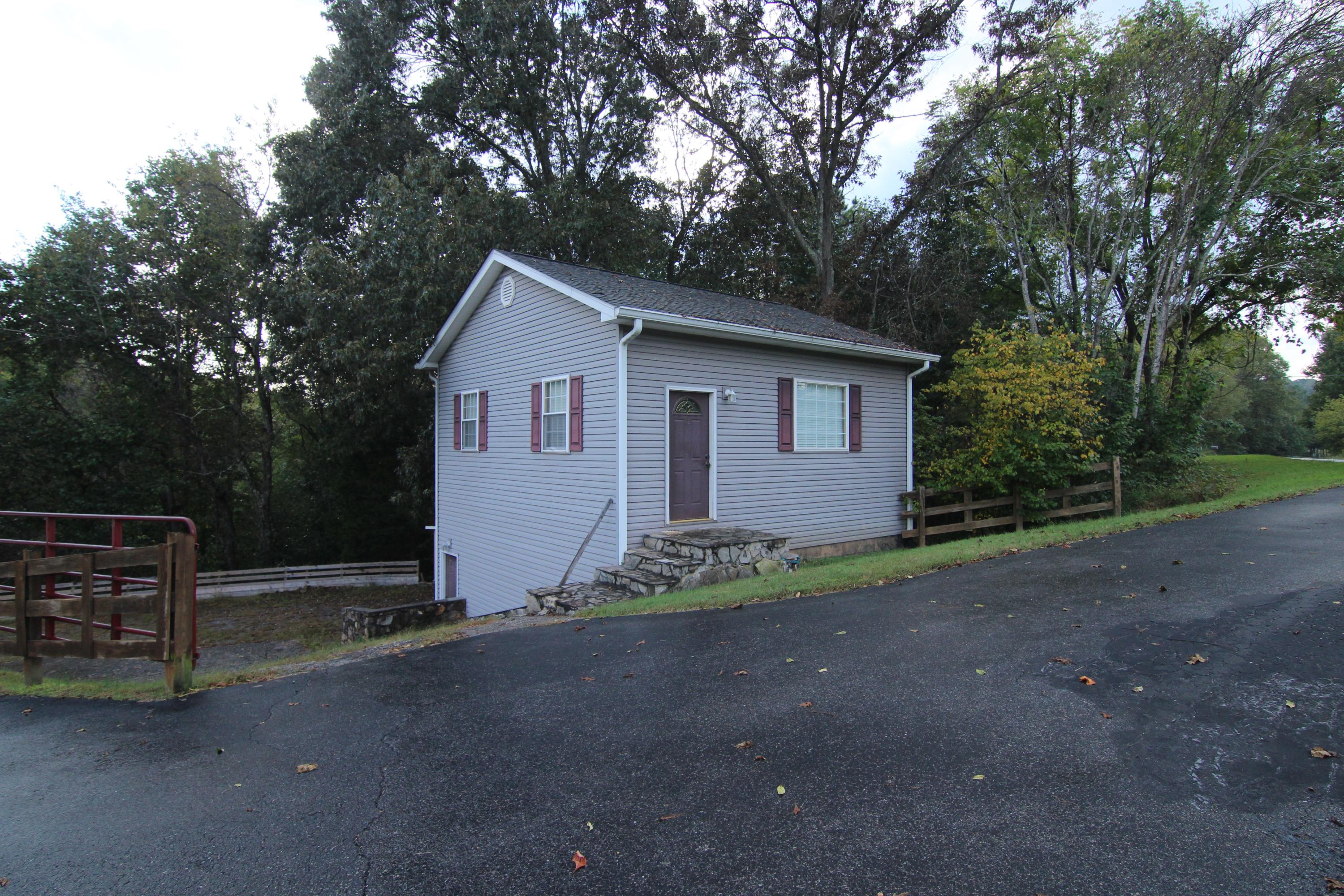 6773 Goodview Road Goodview, VA 24095 - Photo 32 of 43 a house with trees in front of it