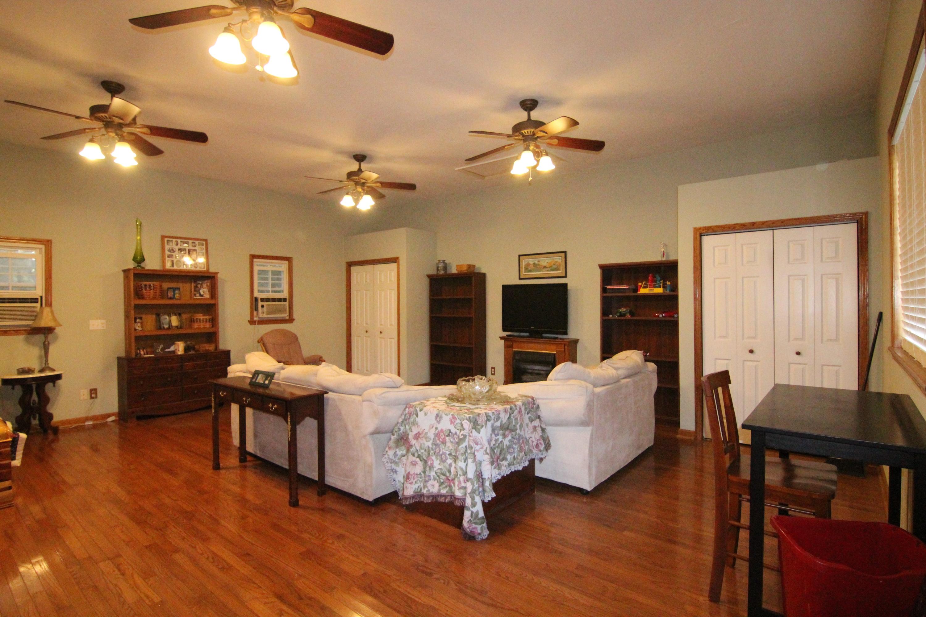 6773 Goodview Road Goodview, VA 24095 - Photo 34 of 43 a living room with furniture and wooden floor
