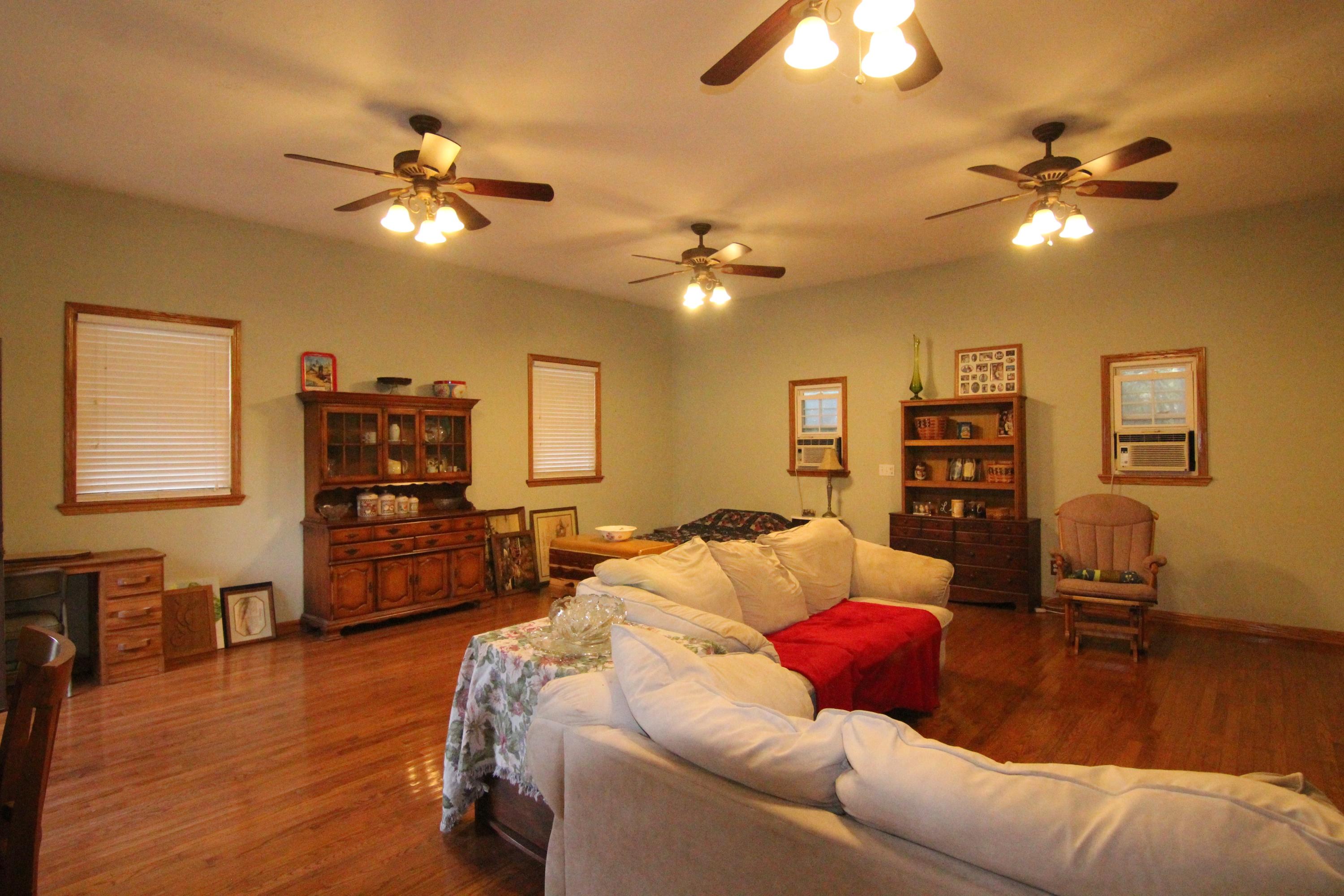 6773 Goodview Road Goodview, VA 24095 - Photo 35 of 43 a living room with furniture and wooden floor