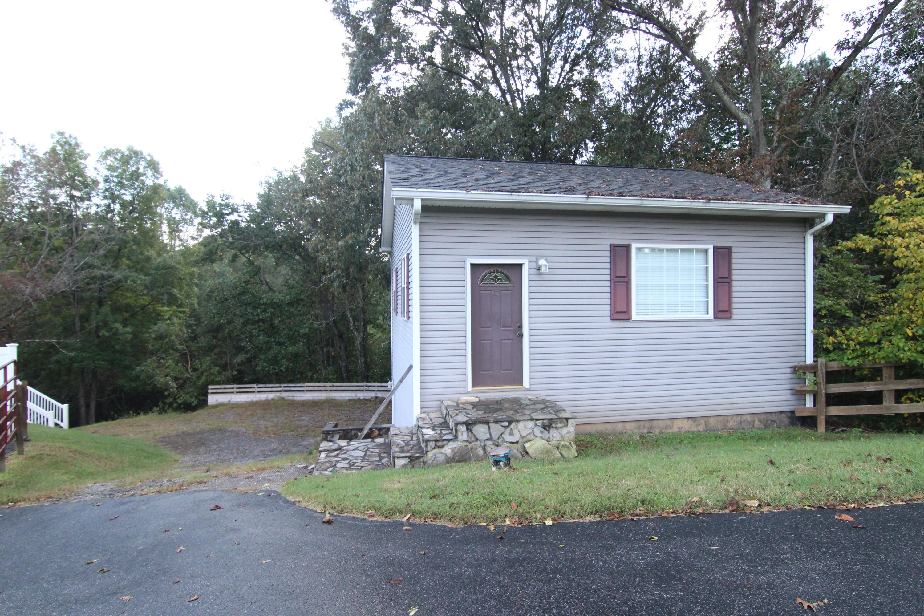6773 Goodview Road Goodview, VA 24095 - Photo 43 of 43 a front view of a house with a yard