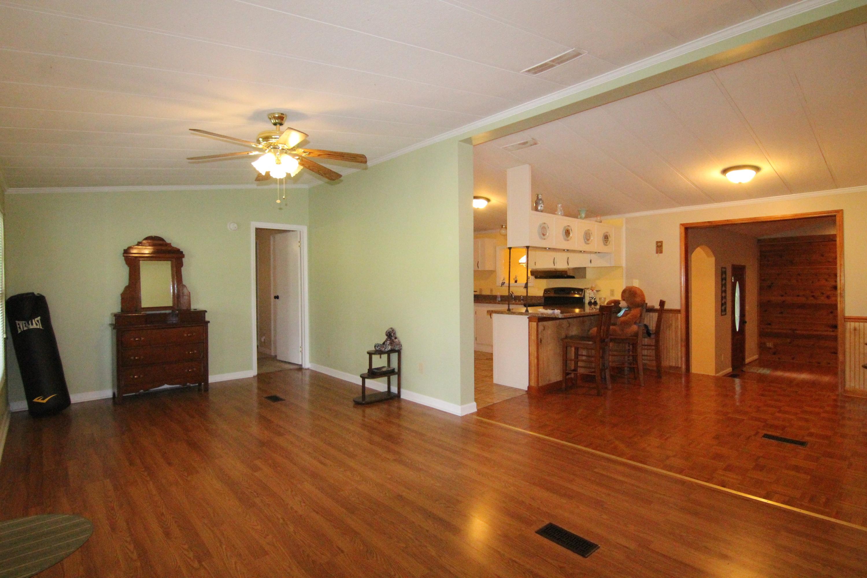 6773 Goodview Road Goodview, VA 24095 - Photo 7 of 43 a view of a livingroom with furniture and a workspace