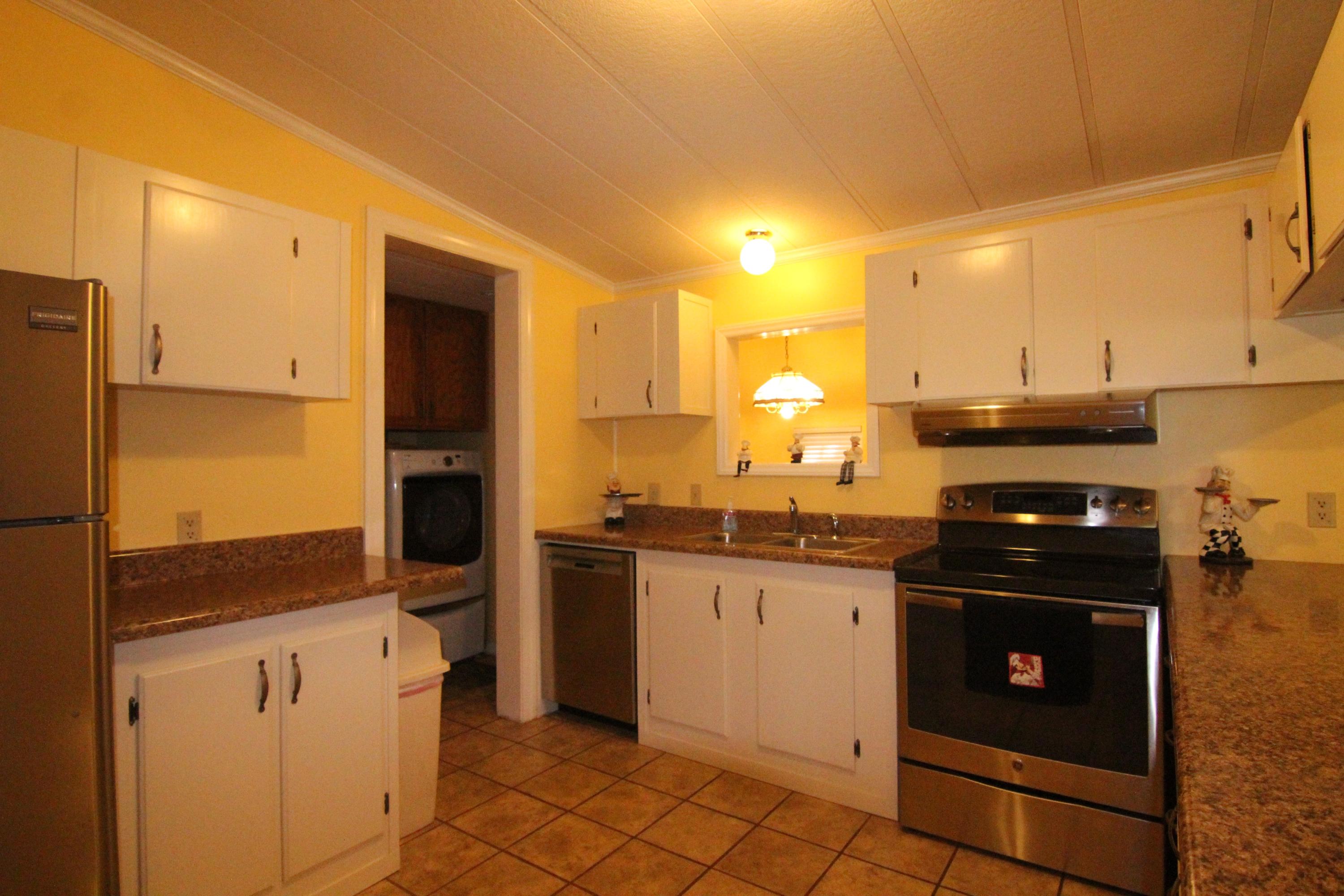 6773 Goodview Road Goodview, VA 24095 - Photo 9 of 43 a kitchen with stainless steel appliances granite countertop a stove a refrigerator and a oven