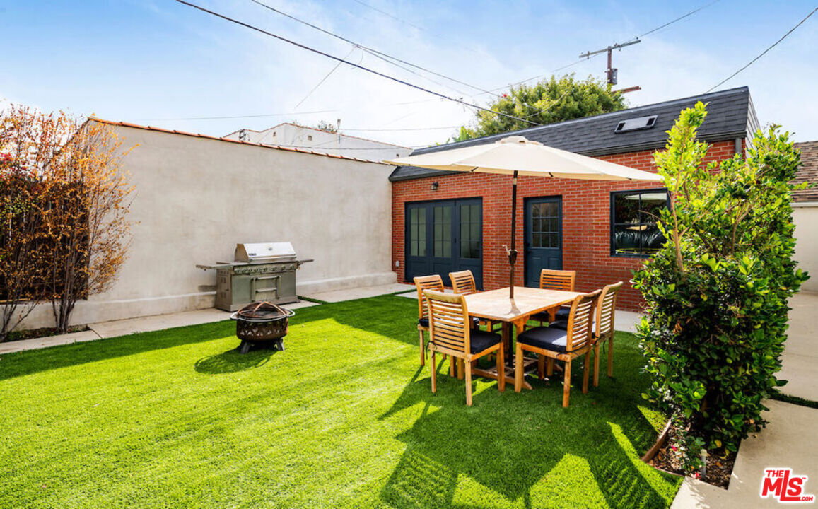 a view of an house with backyard porch and sitting area