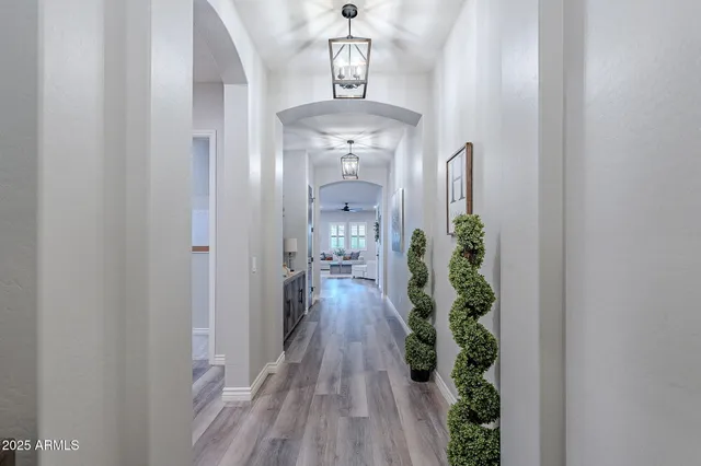 a large kitchen with kitchen island a stove a sink a dining table and chairs