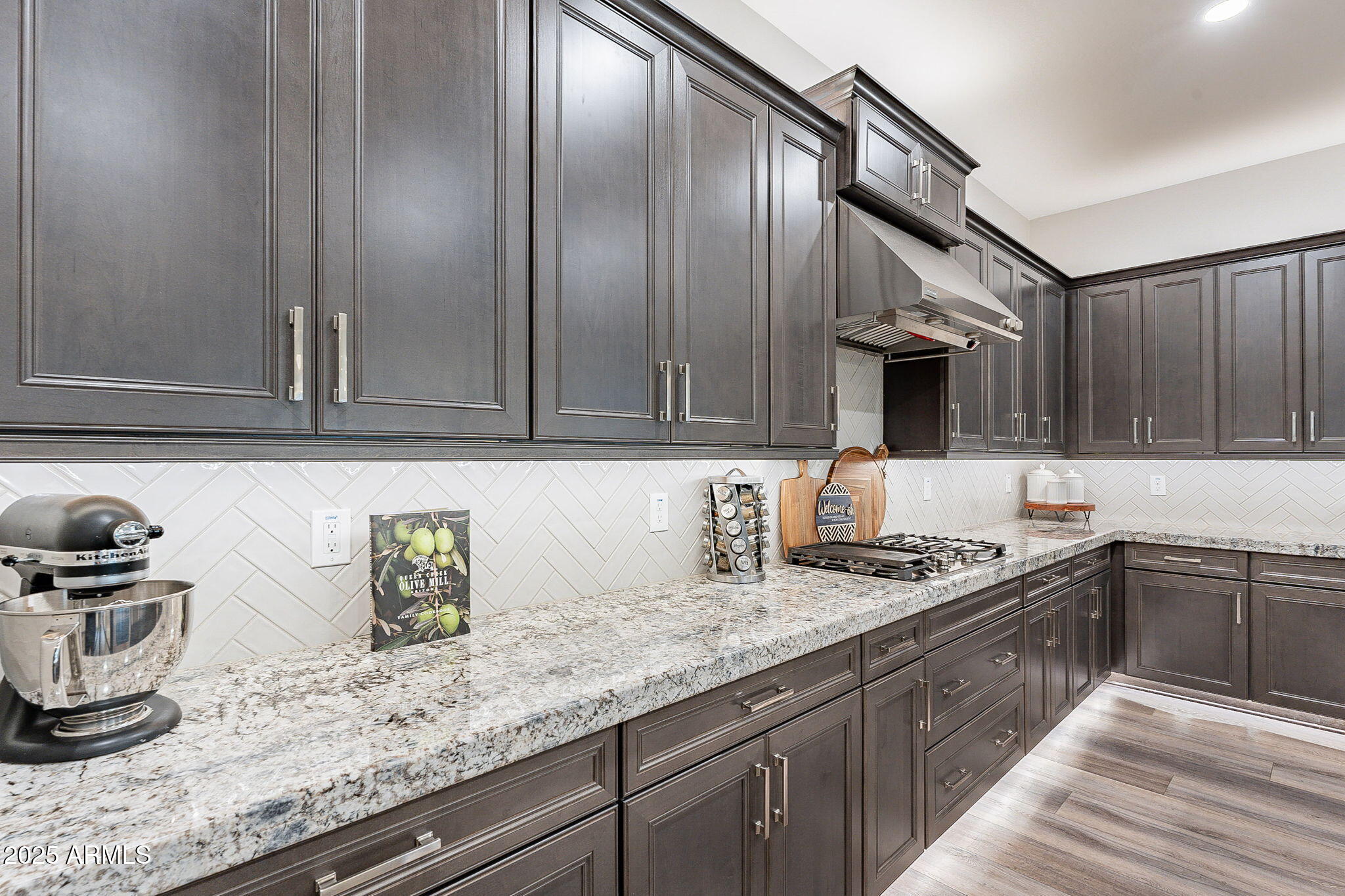 22900 East Reins Road Queen Creek, AZ 85142 - Photo 12 of 74 a kitchen with stainless steel appliances granite countertop a sink stove and cabinets