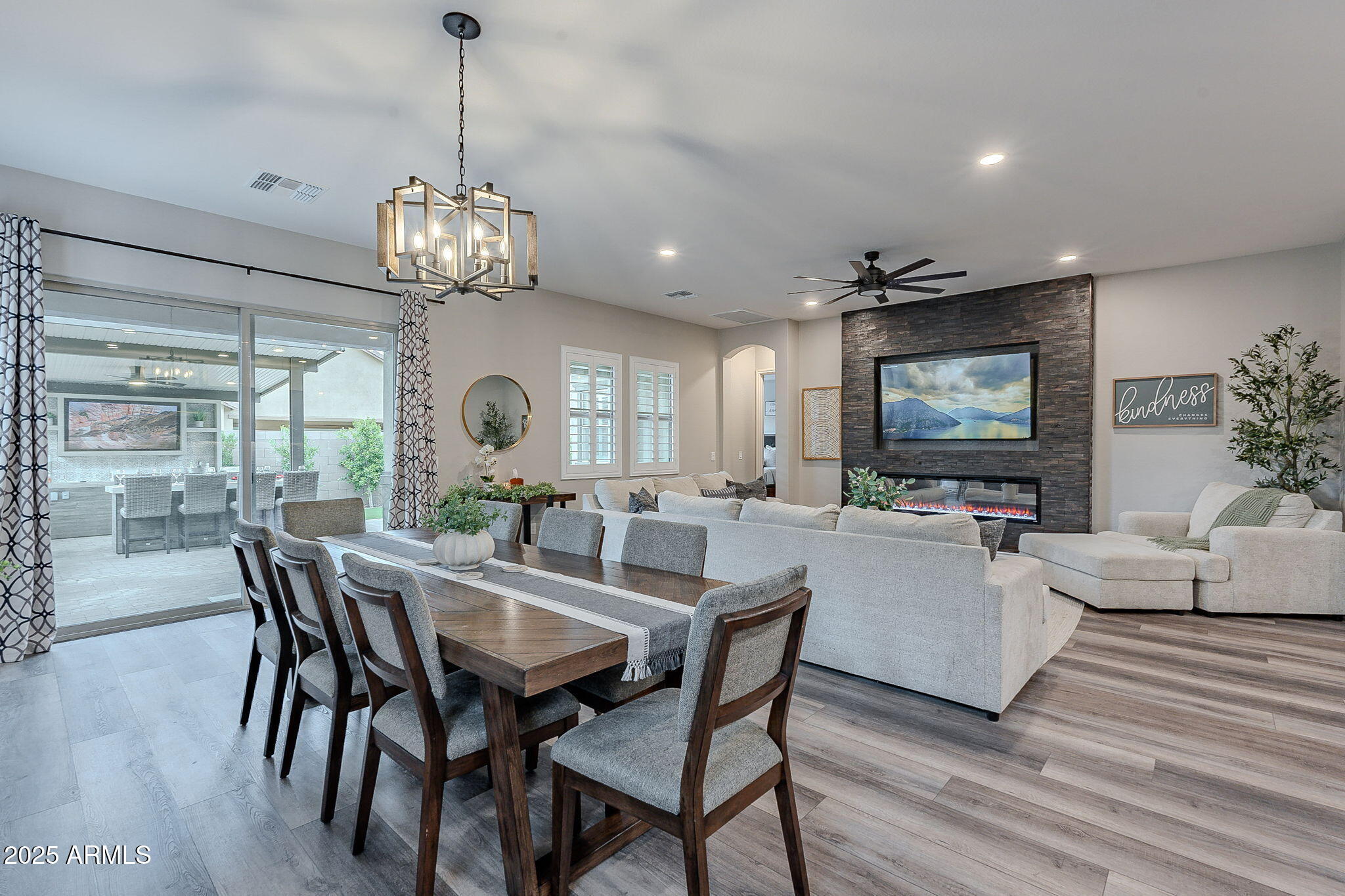 22900 East Reins Road Queen Creek, AZ 85142 - Photo 17 of 74 a view of a dining room with furniture wooden floor and chandelier