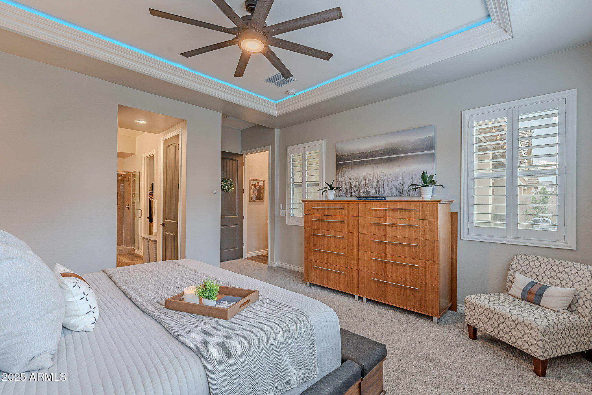 22900 East Reins Road Queen Creek, AZ 85142 - Photo 24 of 74 a bedroom with a bed and a couch