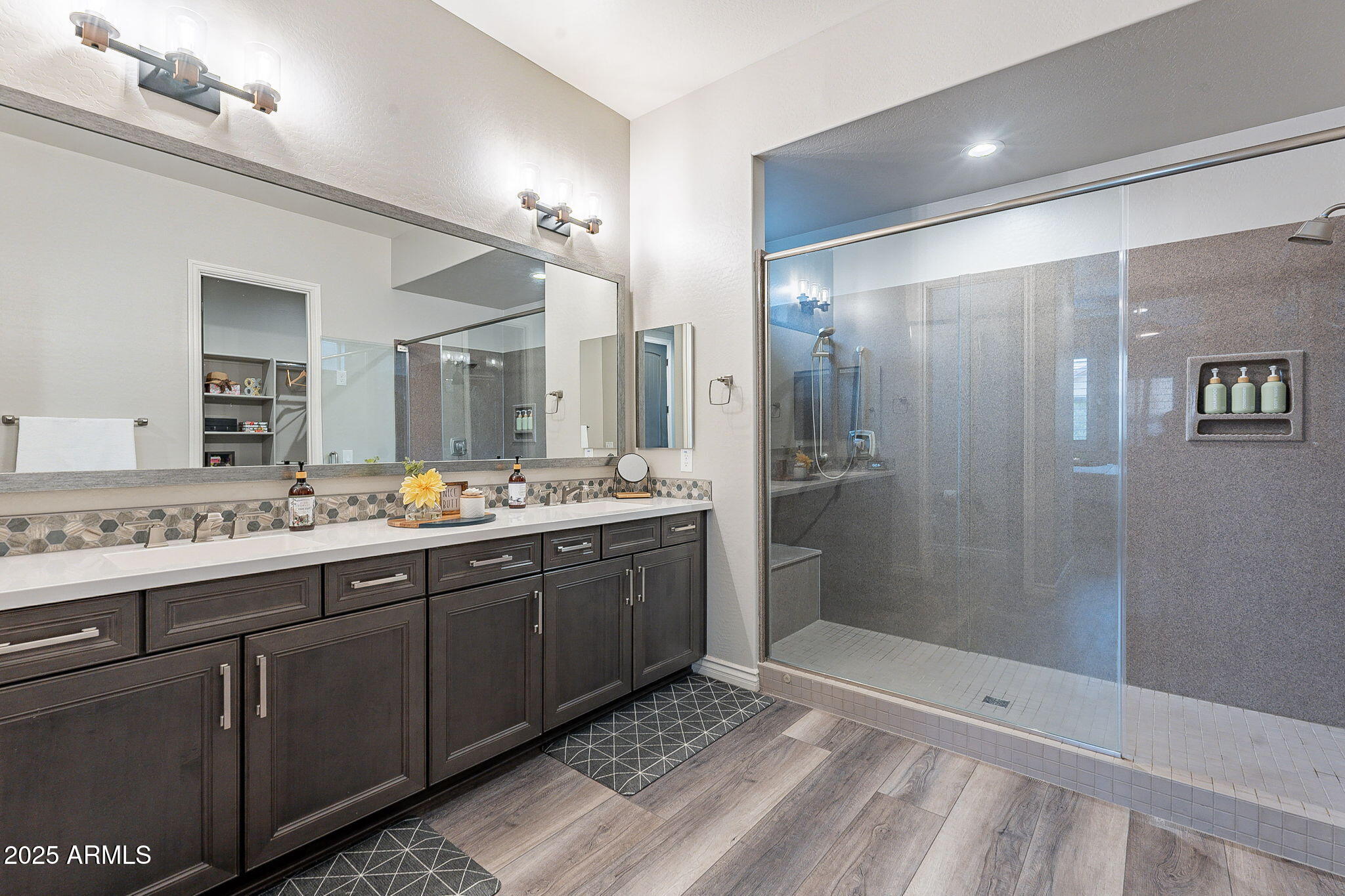 22900 East Reins Road Queen Creek, AZ 85142 - Photo 26 of 74 a bathroom with a double vanity sink mirror and shower
