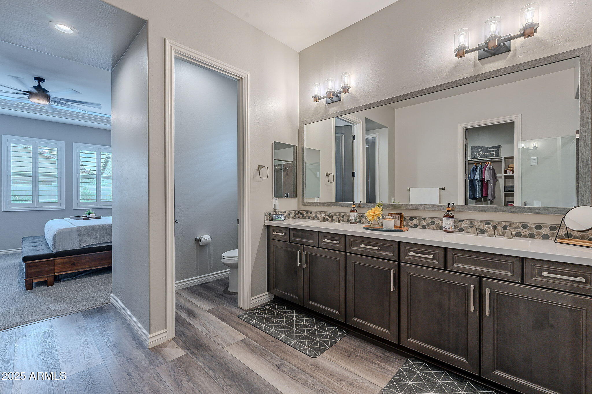 22900 East Reins Road Queen Creek, AZ 85142 - Photo 29 of 74 a spacious bathroom with a double vanity sink and a mirror