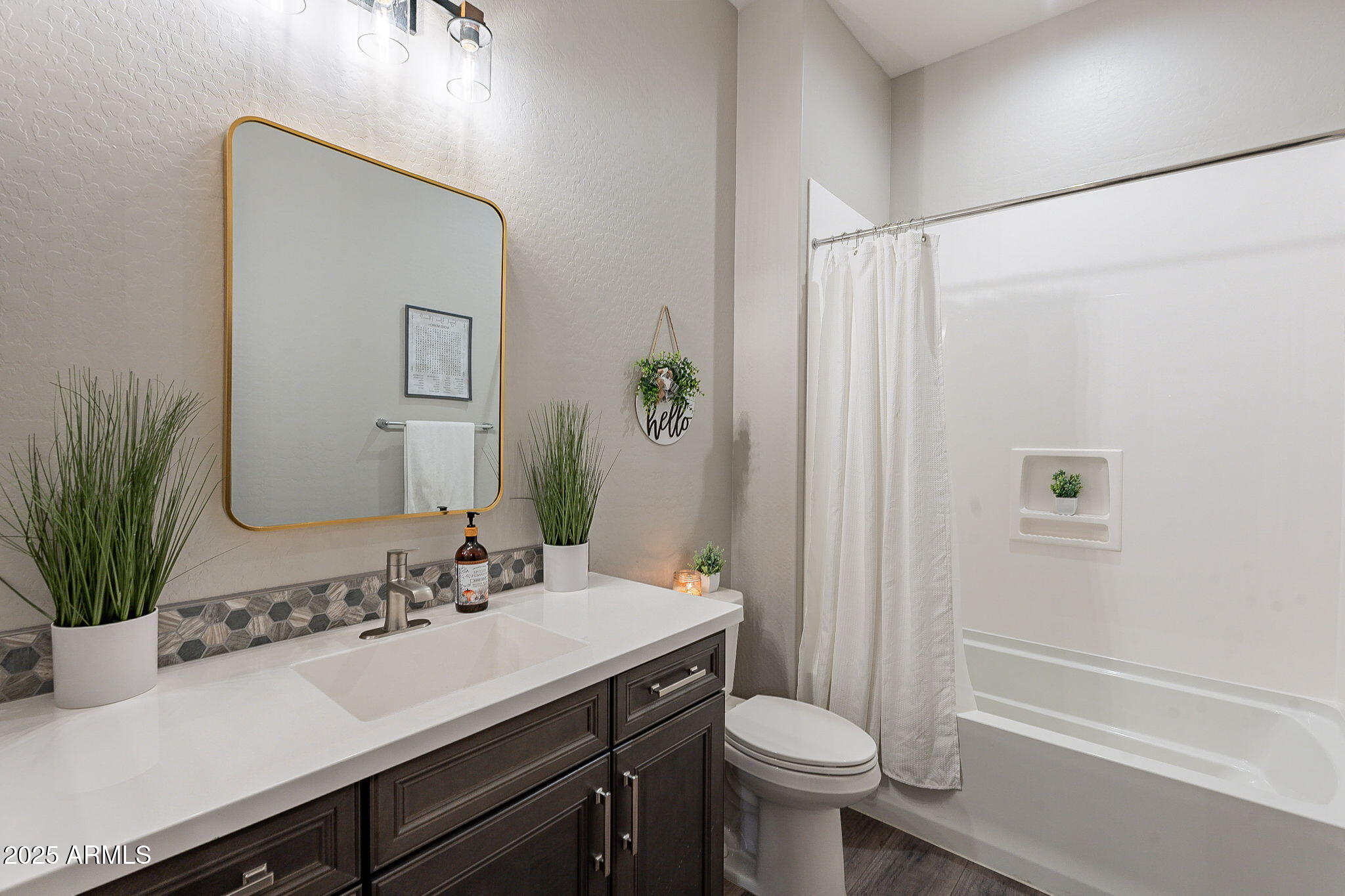 22900 East Reins Road Queen Creek, AZ 85142 - Photo 35 of 74 a bathroom with a sink a toilet a mirror and shower