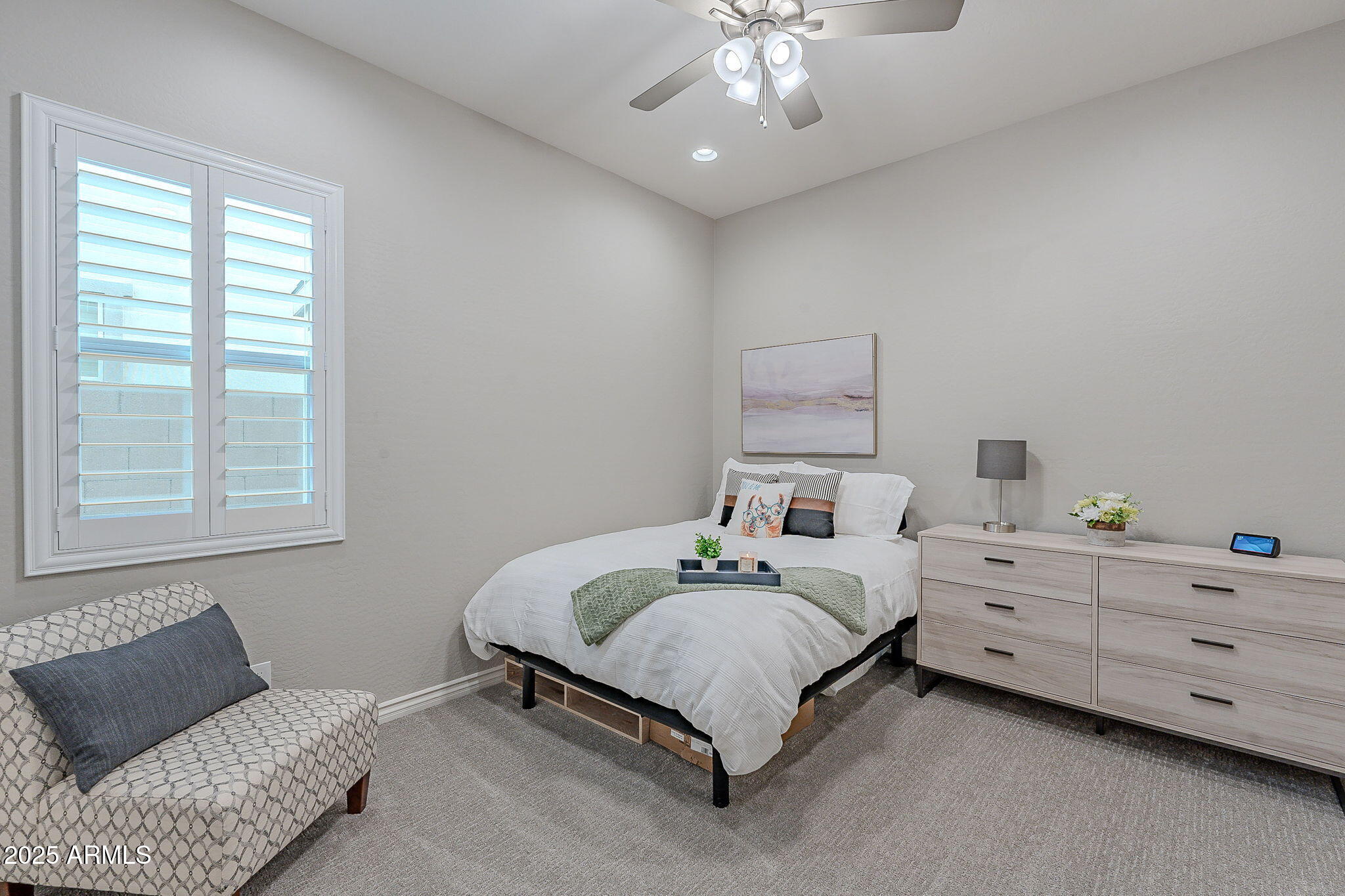 22900 East Reins Road Queen Creek, AZ 85142 - Photo 36 of 74 a bedroom with a bed and a couch