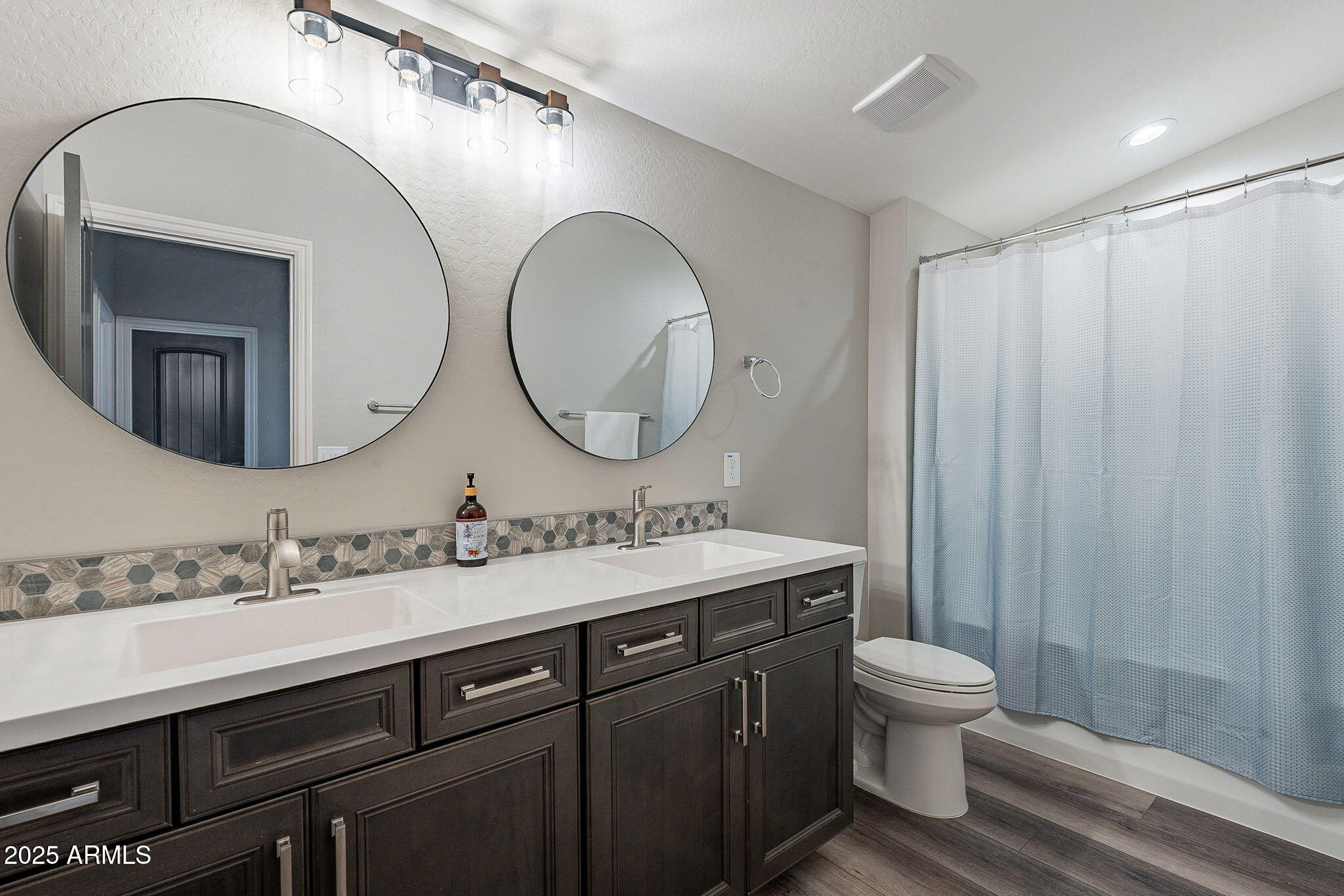 22900 East Reins Road Queen Creek, AZ 85142 - Photo 40 of 74 a bathroom with a double vanity sink mirror and toilet