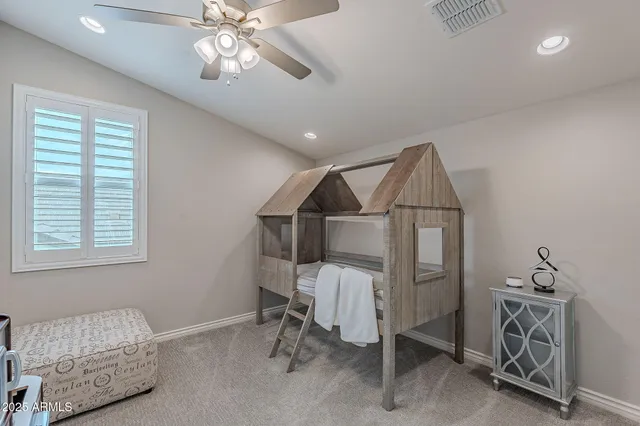 a large kitchen with wooden floor and stainless steel appliances