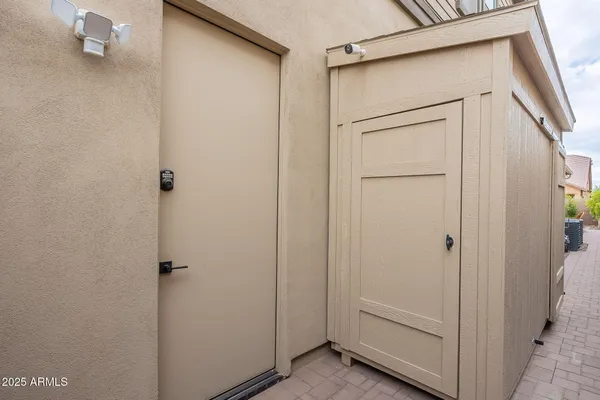 a bed room with furniture and a flat screen tv