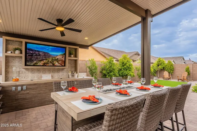 a view of a house with backyard and porch