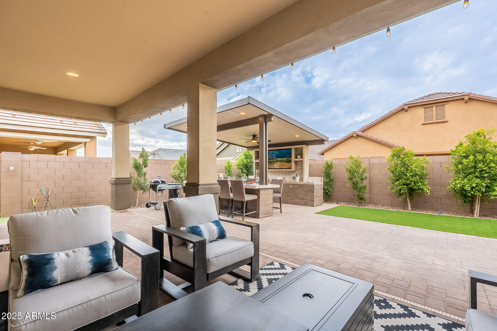 22900 East Reins Road Queen Creek, AZ 85142 - Photo 47 of 74 a living room with patio furniture and a large window