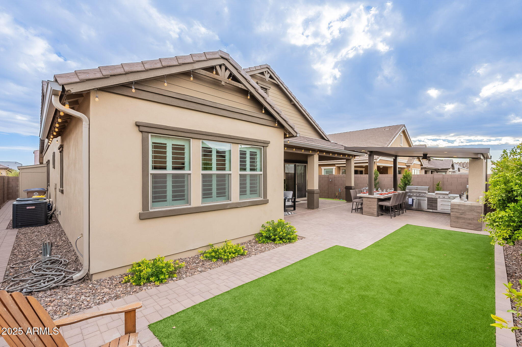 22900 East Reins Road Queen Creek, AZ 85142 - Photo 48 of 74 a front view of a house with swimming pool and garden