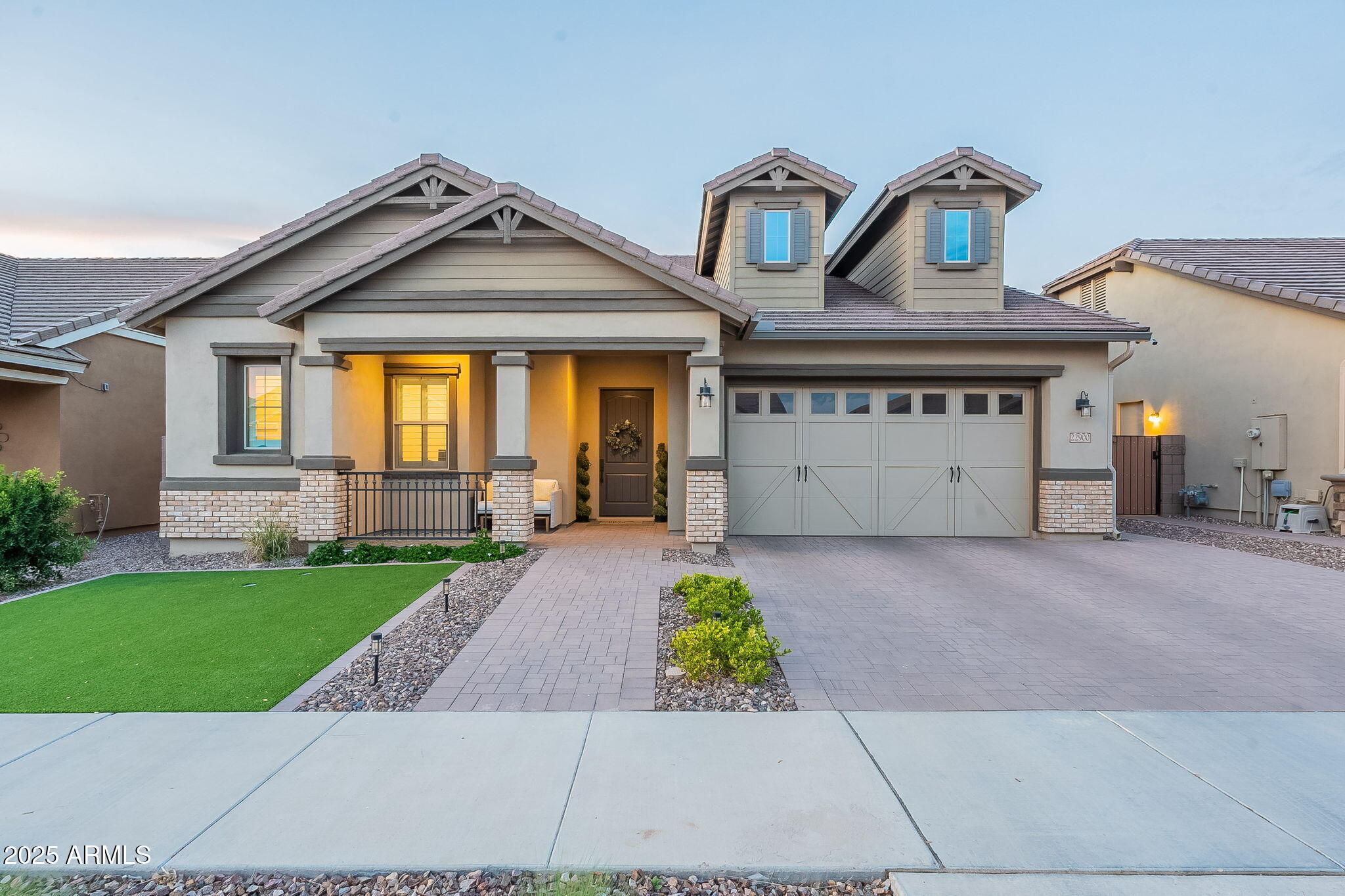 22900 East Reins Road Queen Creek, AZ 85142 - Photo 50 of 74 a front view of a house with a yard and garage