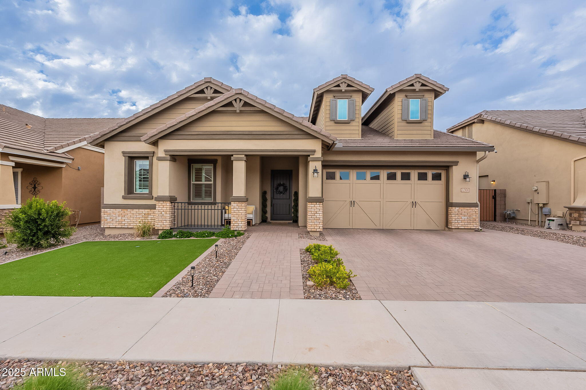 22900 East Reins Road Queen Creek, AZ 85142 - Photo 7 of 74 a front view of a house with a garden and mountain view