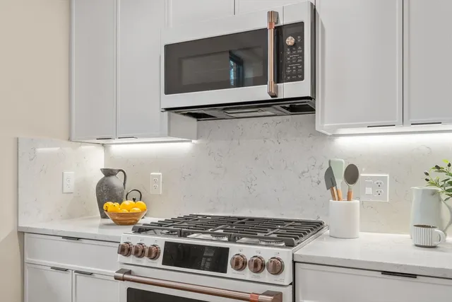 a kitchen with a stove and a microwave
