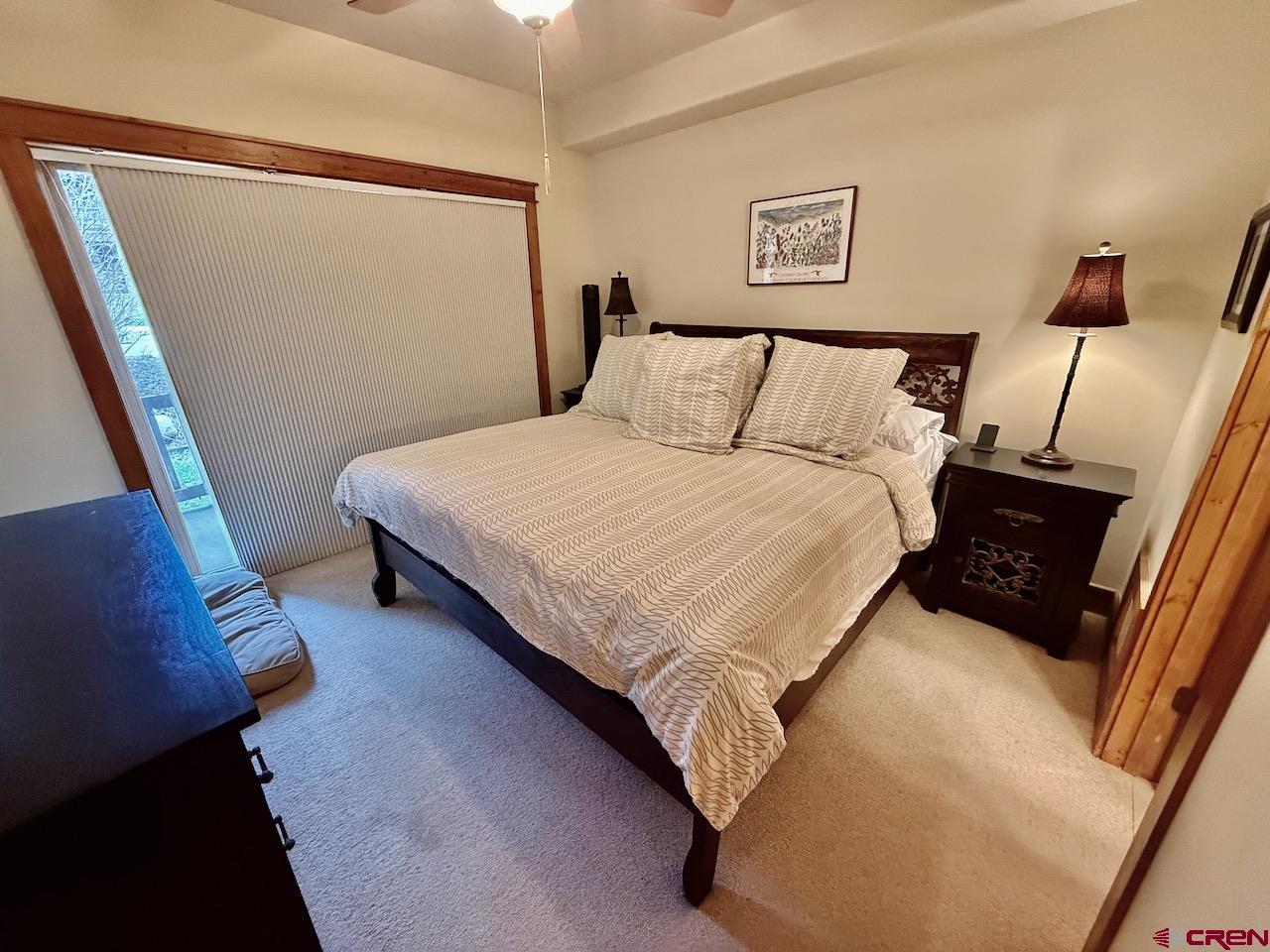 9 Hunter Hill Road, Unit 104 Crested Butte, CO 81225 - Photo 12 of 38 a bedroom with bed and window