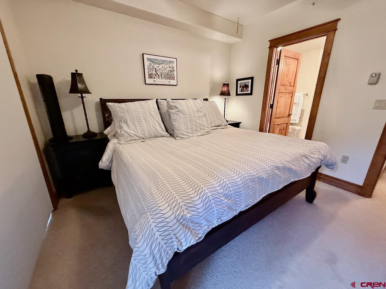 9 Hunter Hill Road, Unit 104 Crested Butte, CO 81225 - Photo 14 of 38 a bedroom with bed and window