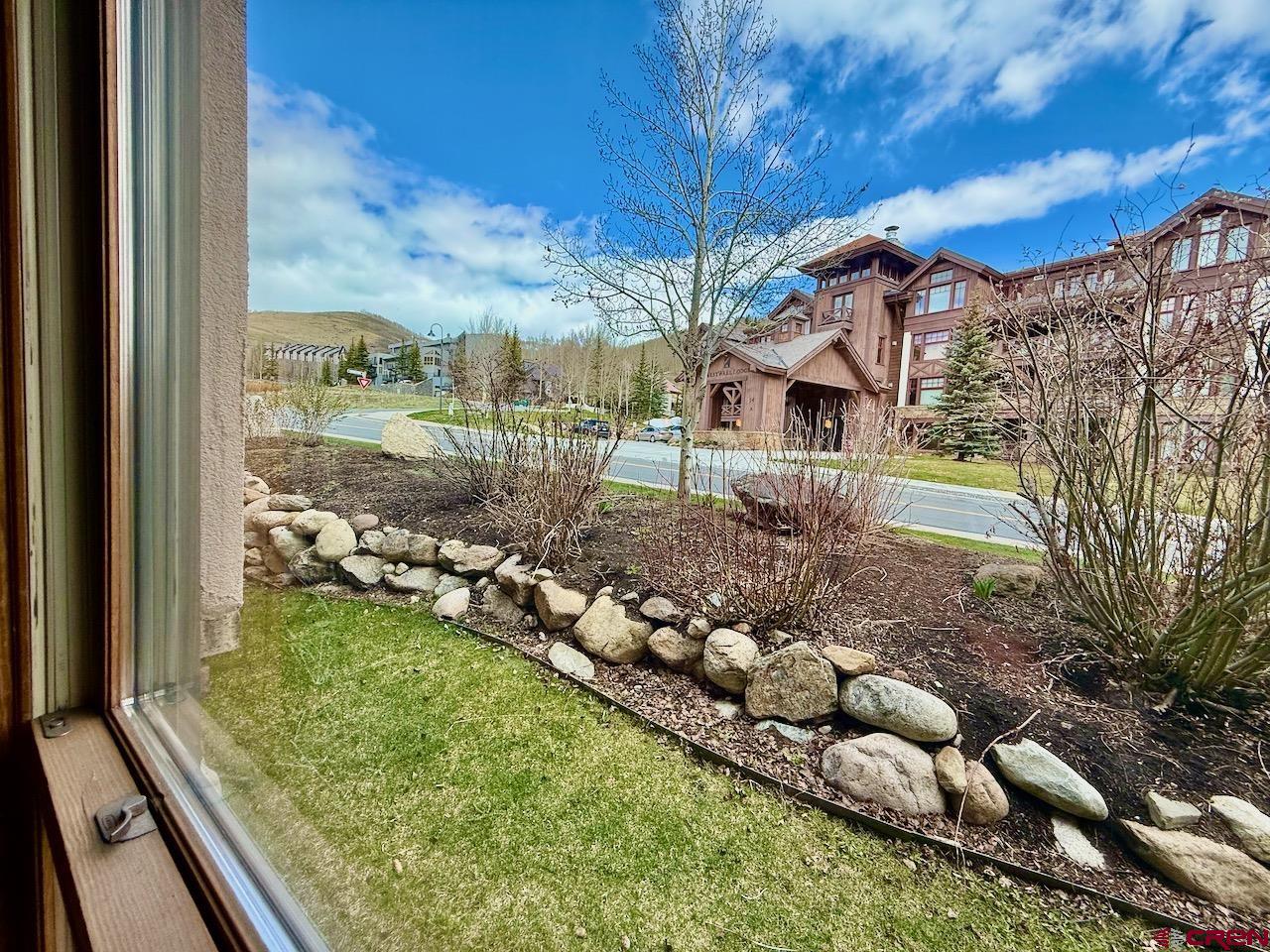9 Hunter Hill Road, Unit 104 Crested Butte, CO 81225 - Photo 26 of 38 a view of a garden from a balcony