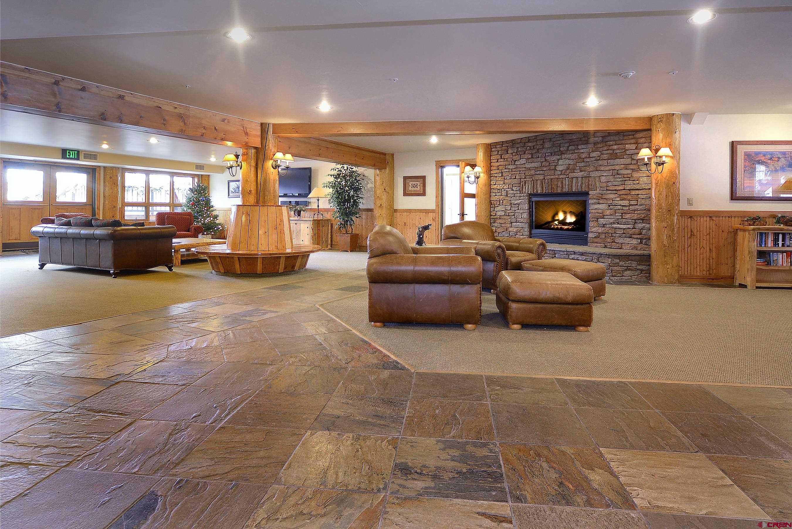 9 Hunter Hill Road, Unit 104 Crested Butte, CO 81225 - Photo 29 of 38 a living room with furniture and a fireplace