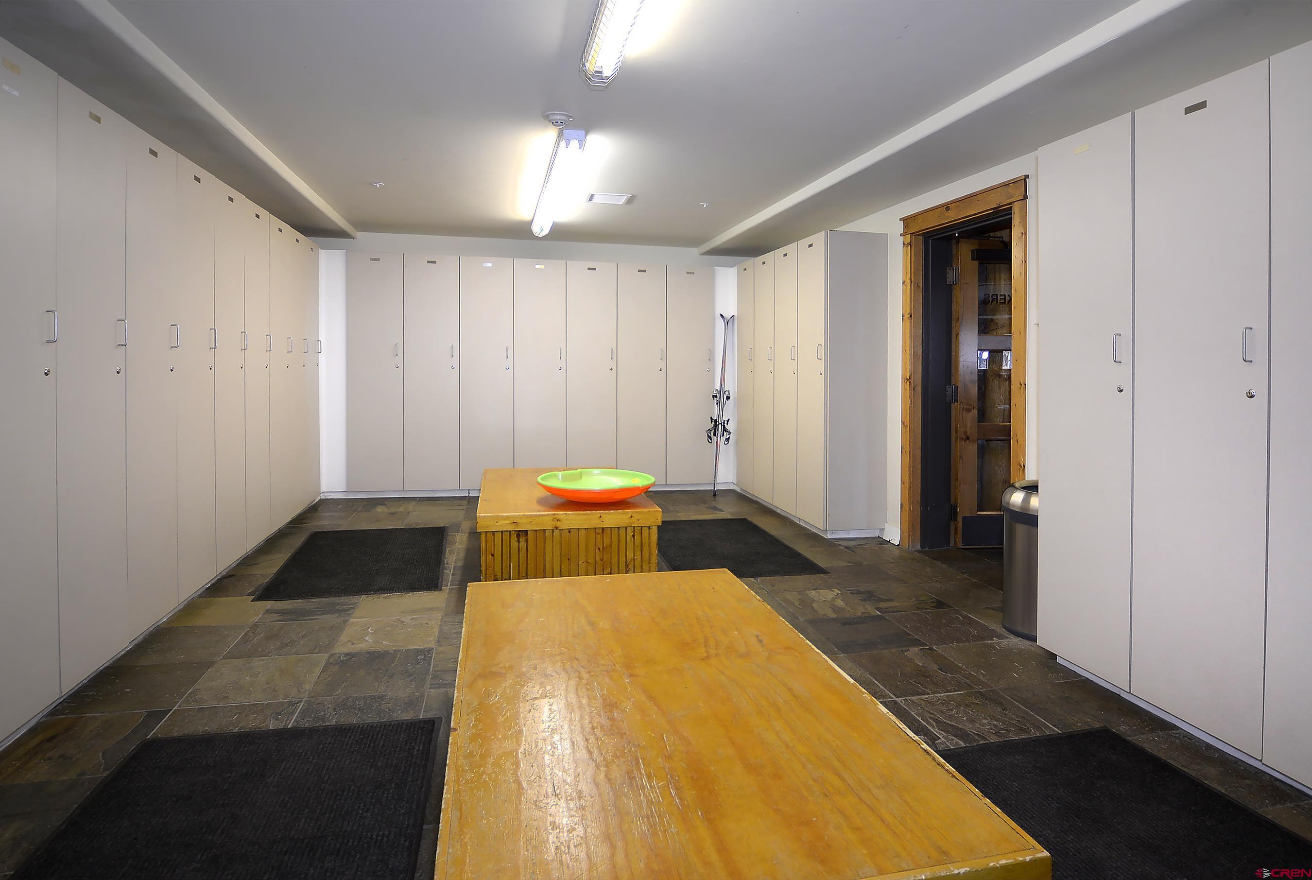 9 Hunter Hill Road, Unit 104 Crested Butte, CO 81225 - Photo 31 of 38 a bedroom with a bed and a walk in closet