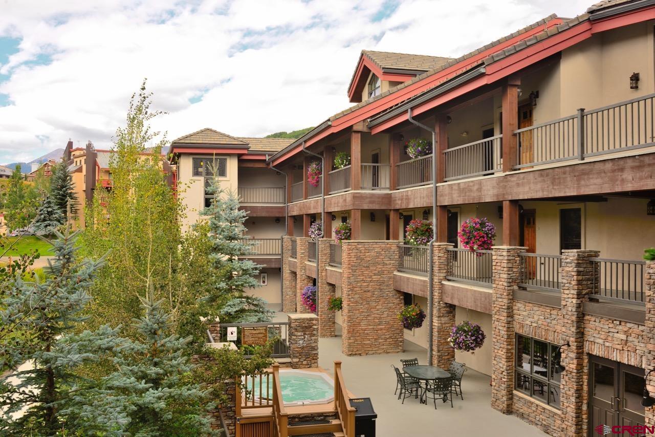 9 Hunter Hill Road, Unit 104 Crested Butte, CO 81225 - Photo 33 of 38 a front view of a building with street view