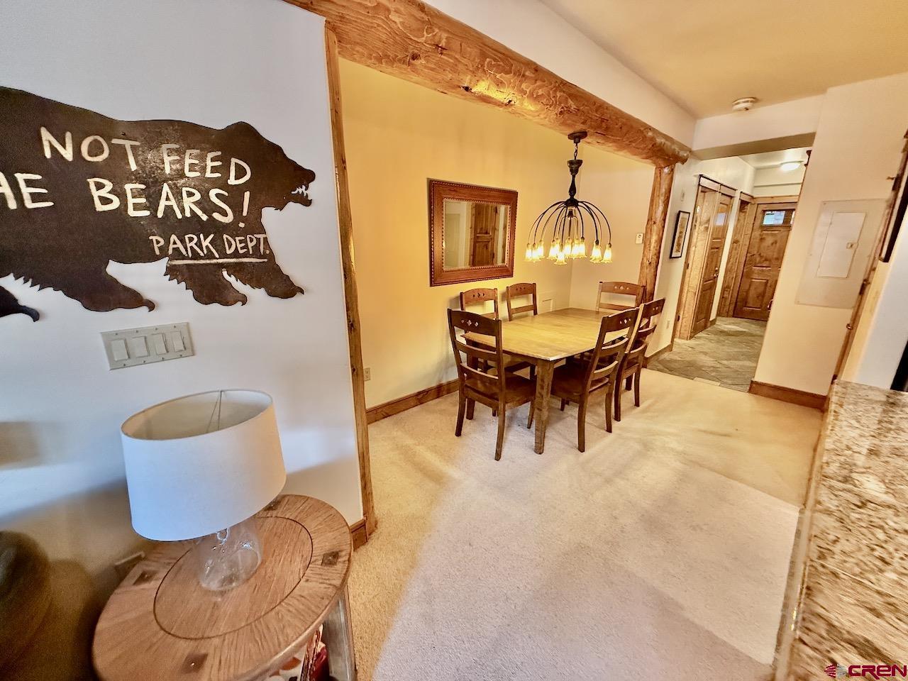 9 Hunter Hill Road, Unit 104 Crested Butte, CO 81225 - Photo 7 of 38 a view of a dining room with furniture