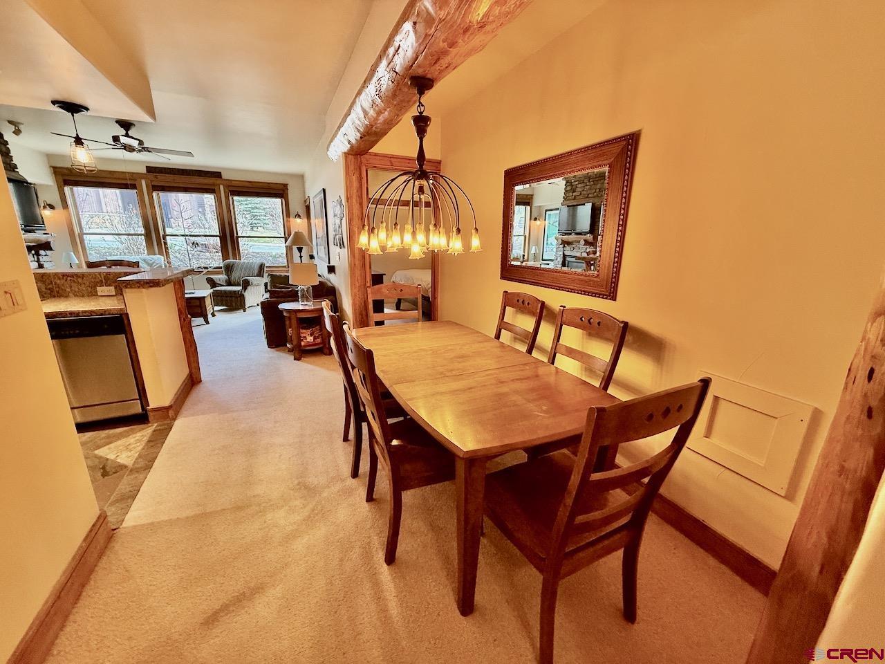 9 Hunter Hill Road, Unit 104 Crested Butte, CO 81225 - Photo 8 of 38 a view of a dining room with furniture and window