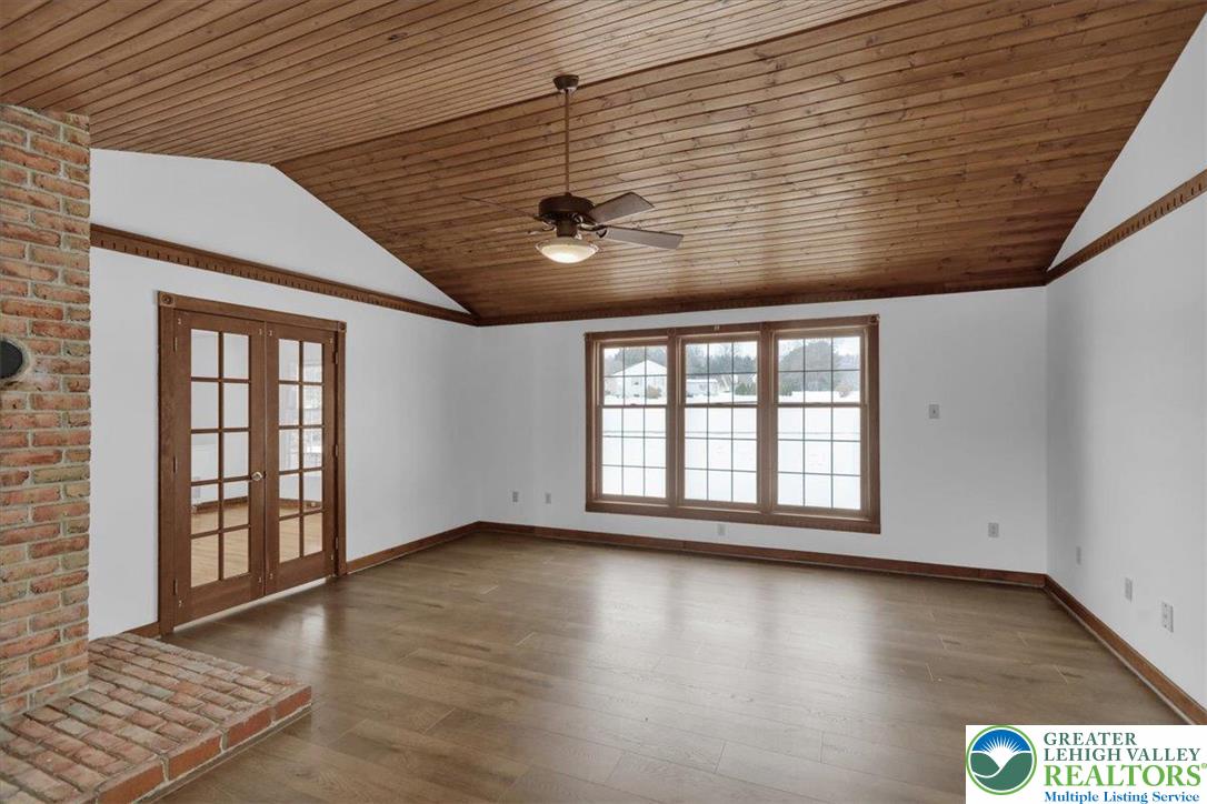 282 Ernst Road Mohrsville, PA 19541 - Photo 15 of 50 an empty room with wooden floor and windows