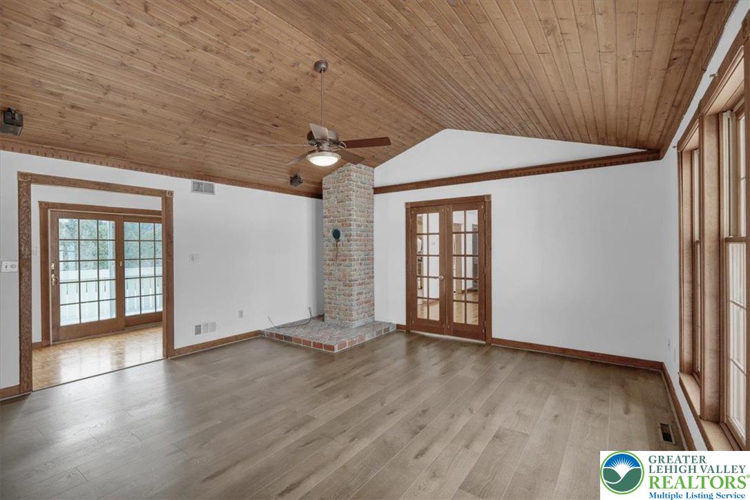 282 Ernst Road Mohrsville, PA 19541 - Photo 17 of 50 an empty room with wooden floor and windows