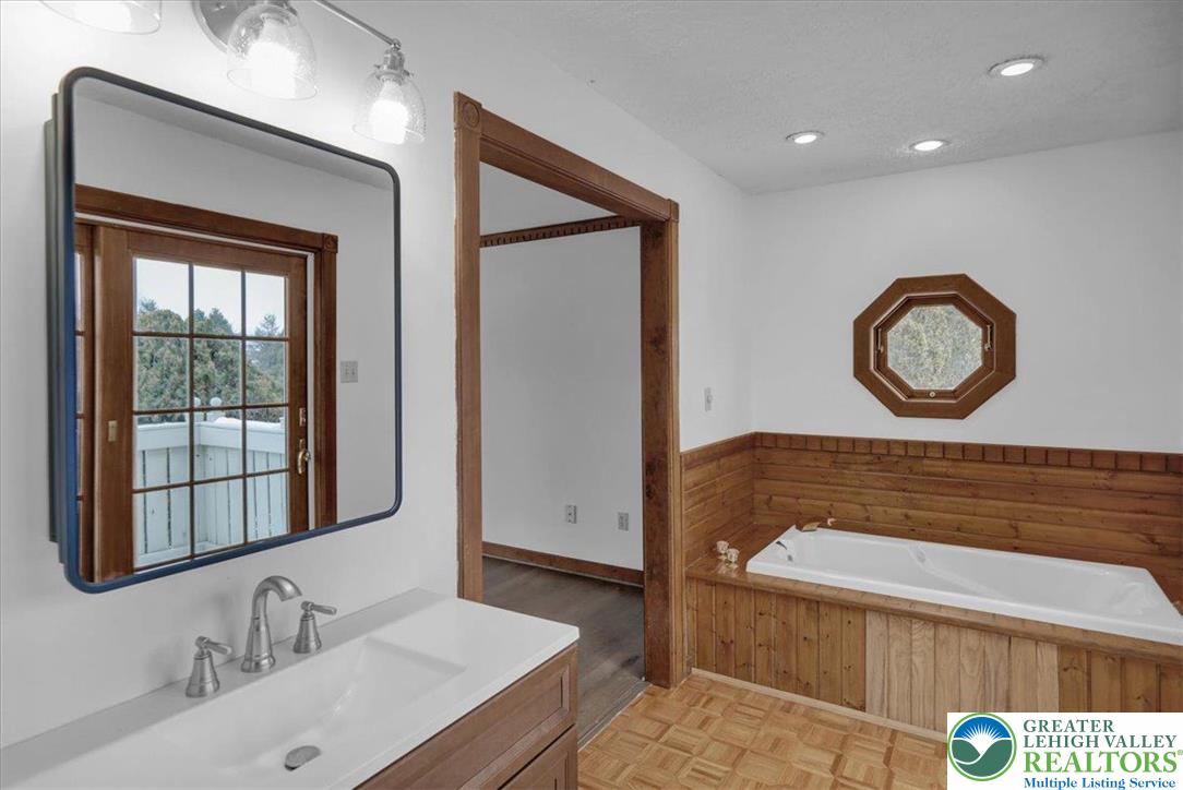 282 Ernst Road Mohrsville, PA 19541 - Photo 18 of 50 a bathroom with a sink and a mirror