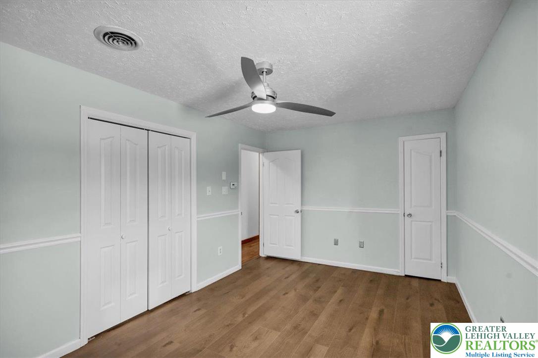 282 Ernst Road Mohrsville, PA 19541 - Photo 24 of 50 a view of an empty room and wooden floor