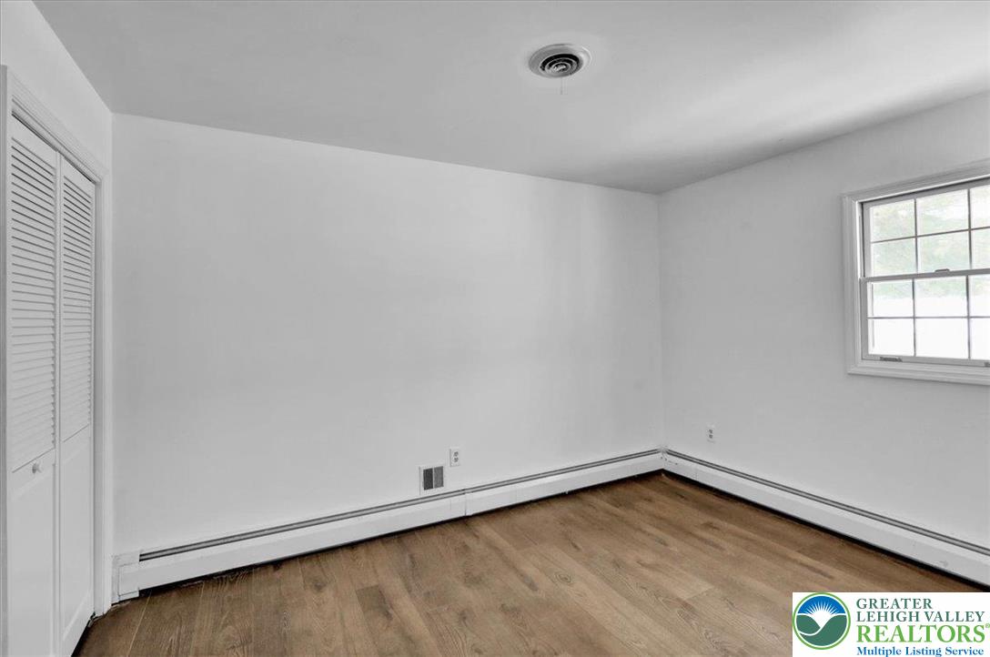 282 Ernst Road Mohrsville, PA 19541 - Photo 25 of 50 an empty room with wooden floor and windows