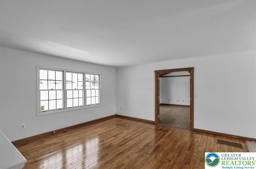 282 Ernst Road Mohrsville, PA 19541 - Photo 5 of 50 an empty room with wooden floor and windows