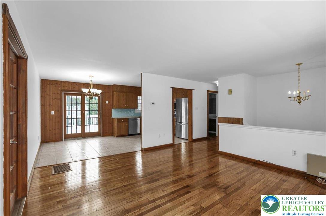 282 Ernst Road Mohrsville, PA 19541 - Photo 9 of 50 a view of a big room with wooden floor and windows