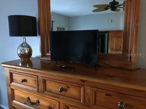 a kitchen with a microwave and cabinets