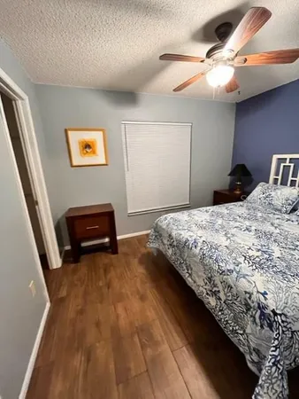 a bedroom with a bed and a piano
