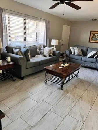 a living room with furniture and a window