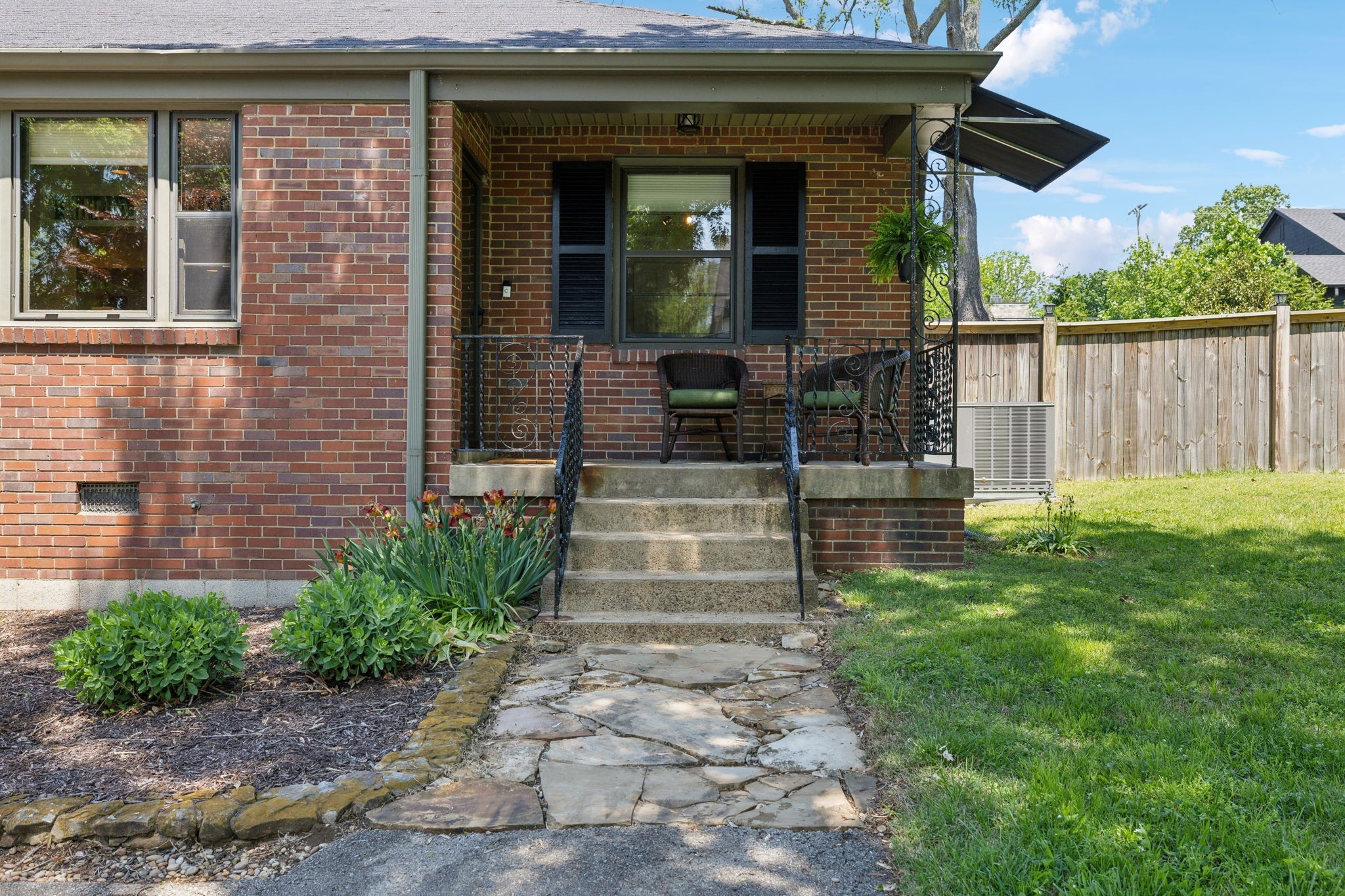 4202 Murphy Road Nashville, TN 37209 - Photo 2 of 34 a front view of a house with plants