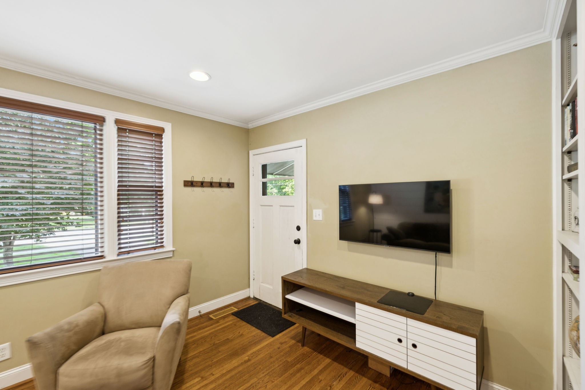 4202 Murphy Road Nashville, TN 37209 - Photo 21 of 34 a living room with a flat screen tv on dresser and a window