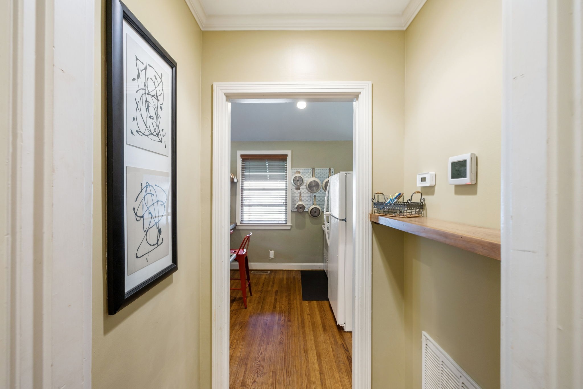 4202 Murphy Road Nashville, TN 37209 - Photo 22 of 34 a view of a hallway view with wooden floor and dining room