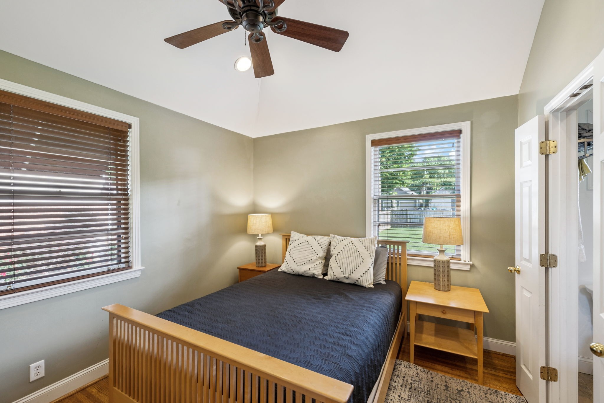 4202 Murphy Road Nashville, TN 37209 - Photo 25 of 34 a bedroom with a bed and wooden floor