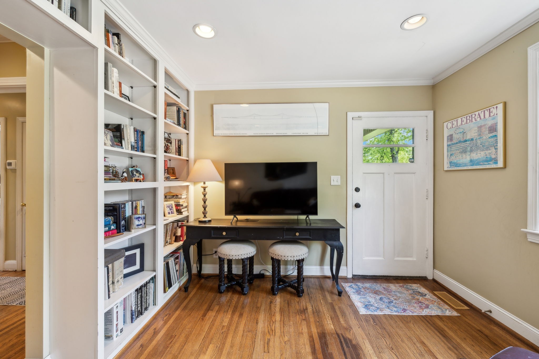 4202 Murphy Road Nashville, TN 37209 - Photo 5 of 34 a workspace with furniture bookshelf and a window