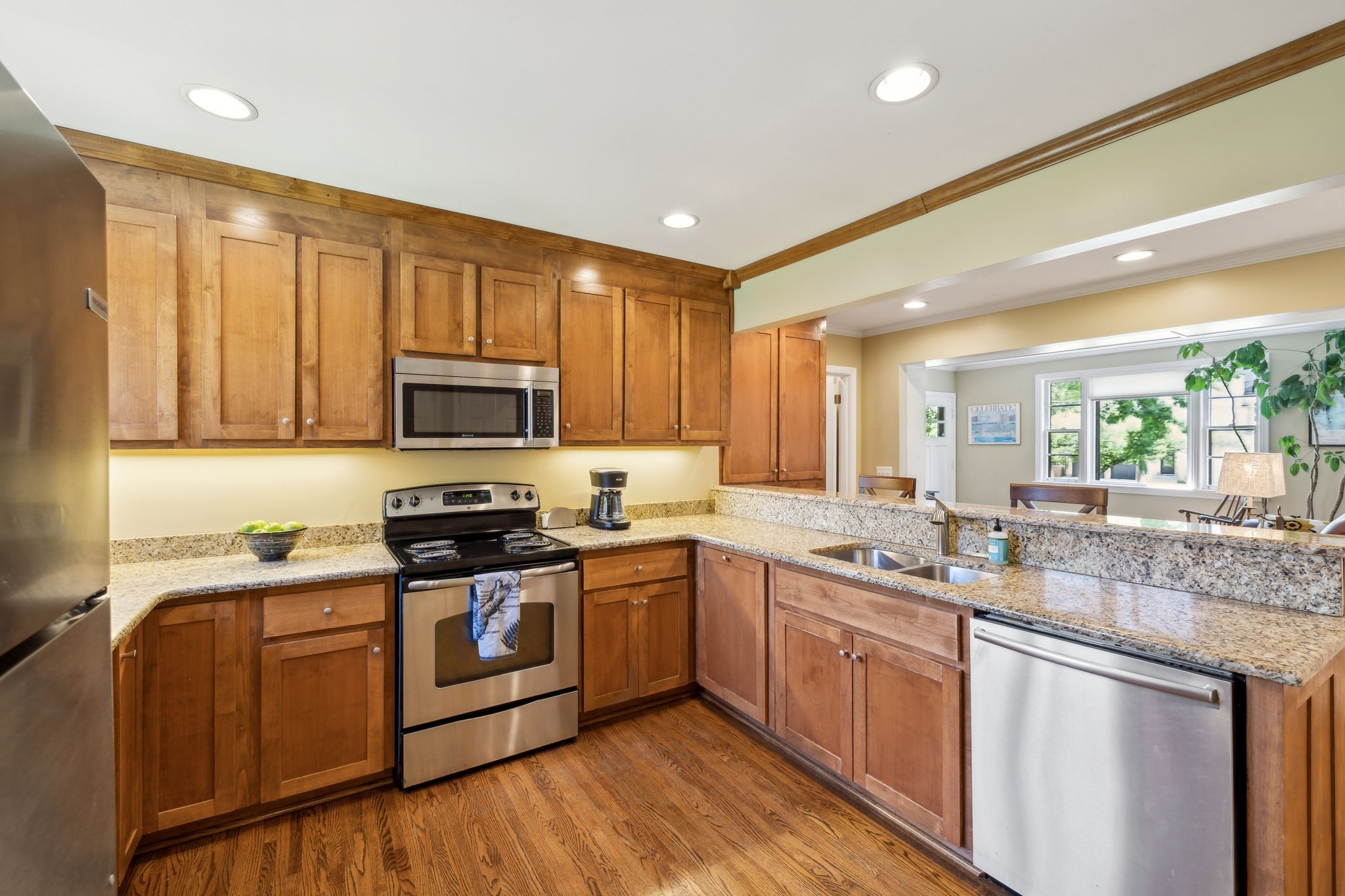 4202 Murphy Road Nashville, TN 37209 - Photo 8 of 34 a kitchen with stainless steel appliances granite countertop a sink stove cabinets and wooden floor