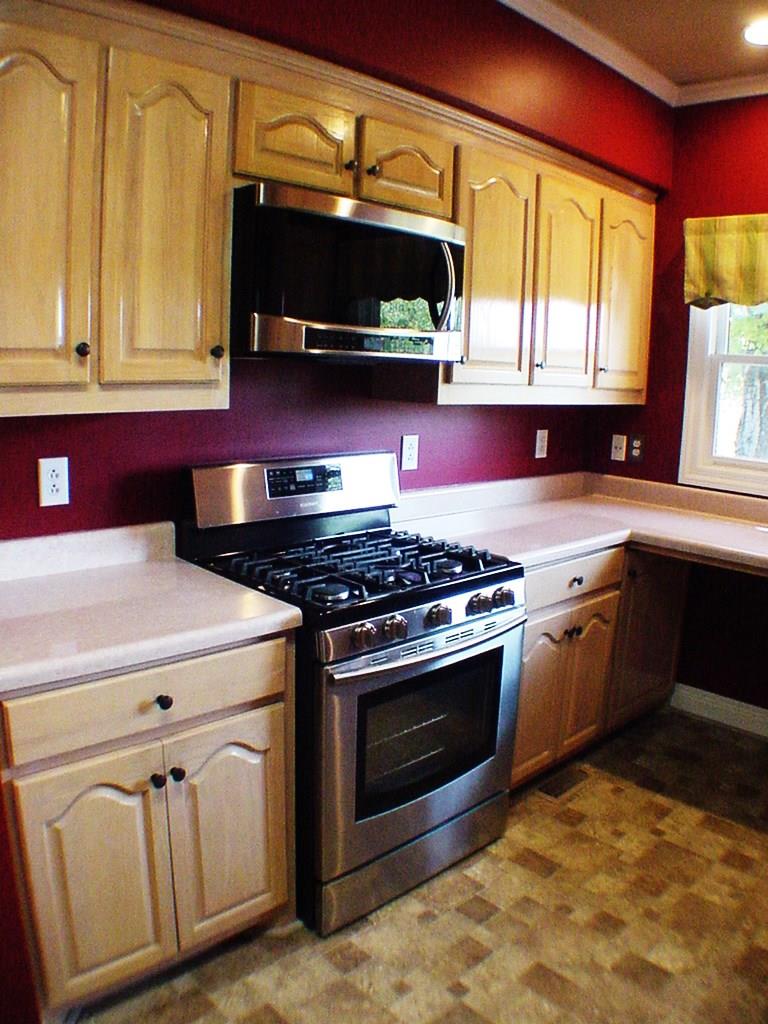 1920 Rock Springs Road Columbia, TN 38401 - Photo 5 of 27 Kitchen appliances include gas stove, microwave, dishwasher and refrigerator.